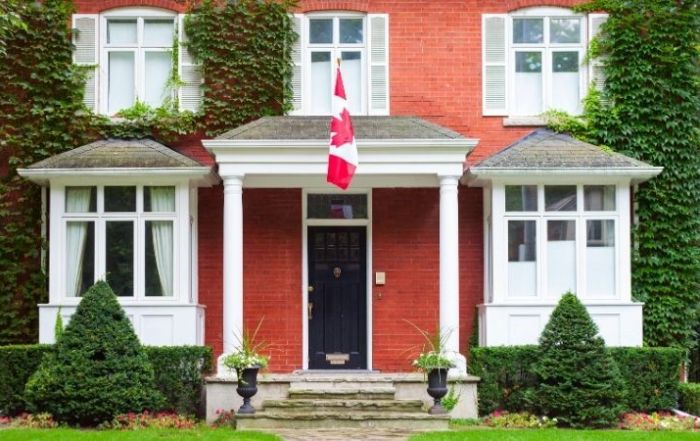 Canadian real estate detached house with flag