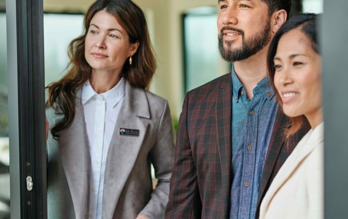RE/MAX Agent with home-buying clients