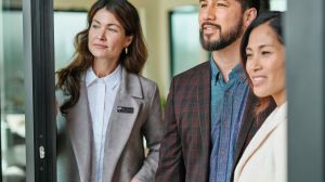 RE/MAX Agent with home-buying clients