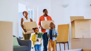 Family moving in and talking about How Much to Budget for Moving Costs